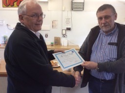 KenToone receiving his certificate for his Cowans Sheldon crane winner of the Picknell trophy for a completed model.